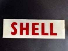 A small Shell glass petrol pump brand indicator, 12 1/2 x 3 3/4".