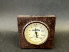 An Avon Tyres branded bakelite desktop thermometer.