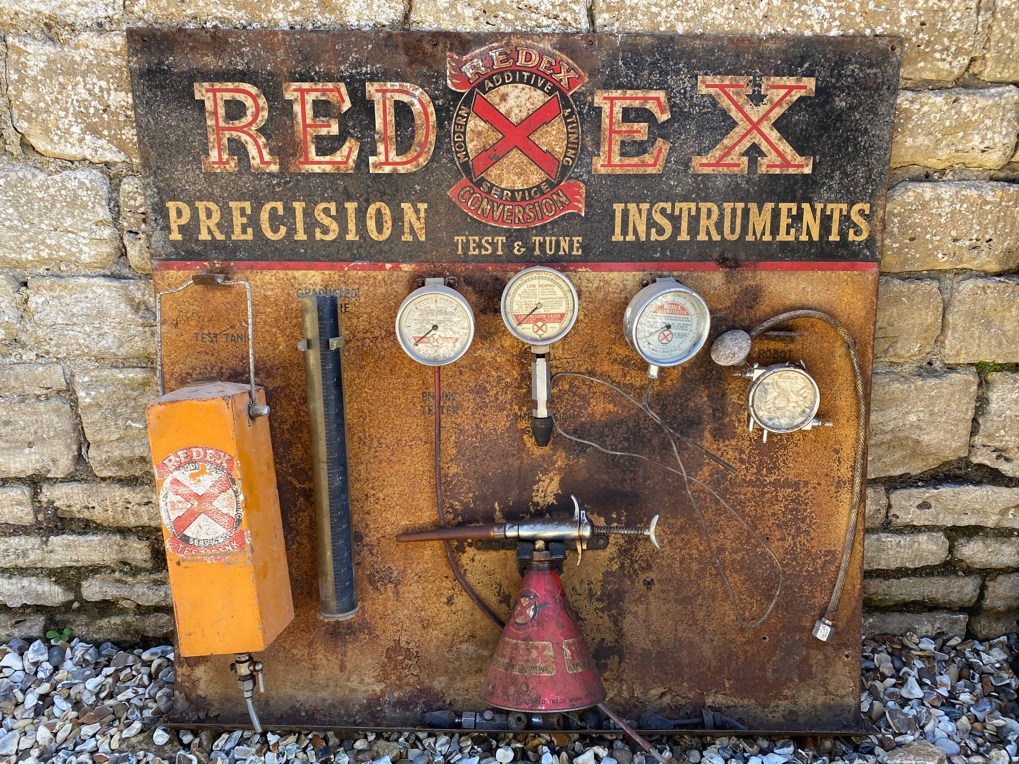 A Redex Precision Instruments garage display board, with various Redex equipment attached, 36 x