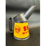 A Shell Motor Oil pint measure in superb condition, dated 1948.