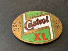 A Castrol XL enamel on brass oval price tag.