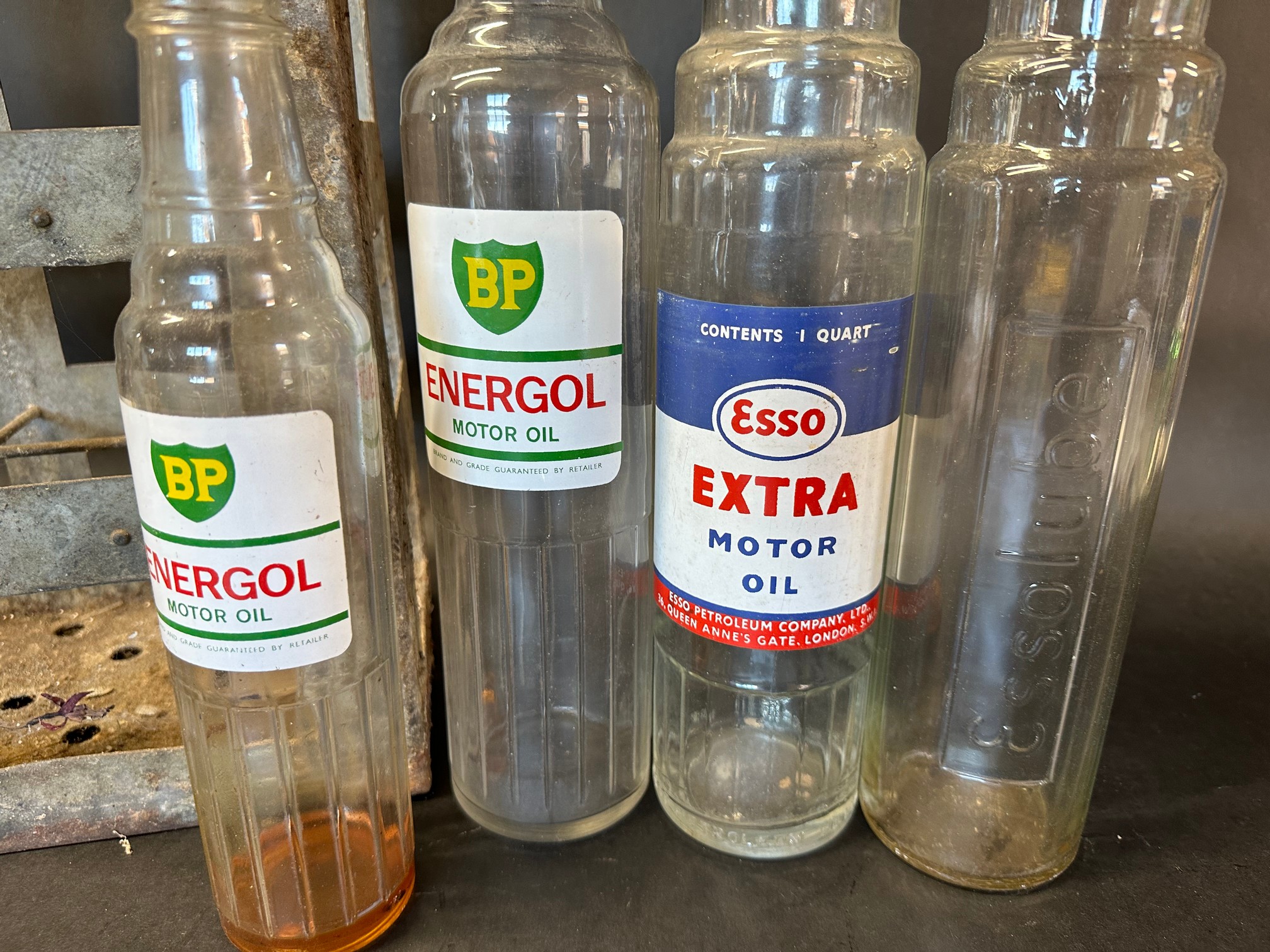 Three quart oil bottles, BP Energol, Essolube and Esso Extra plus a pint BP Energol and a galvanised - Image 2 of 2