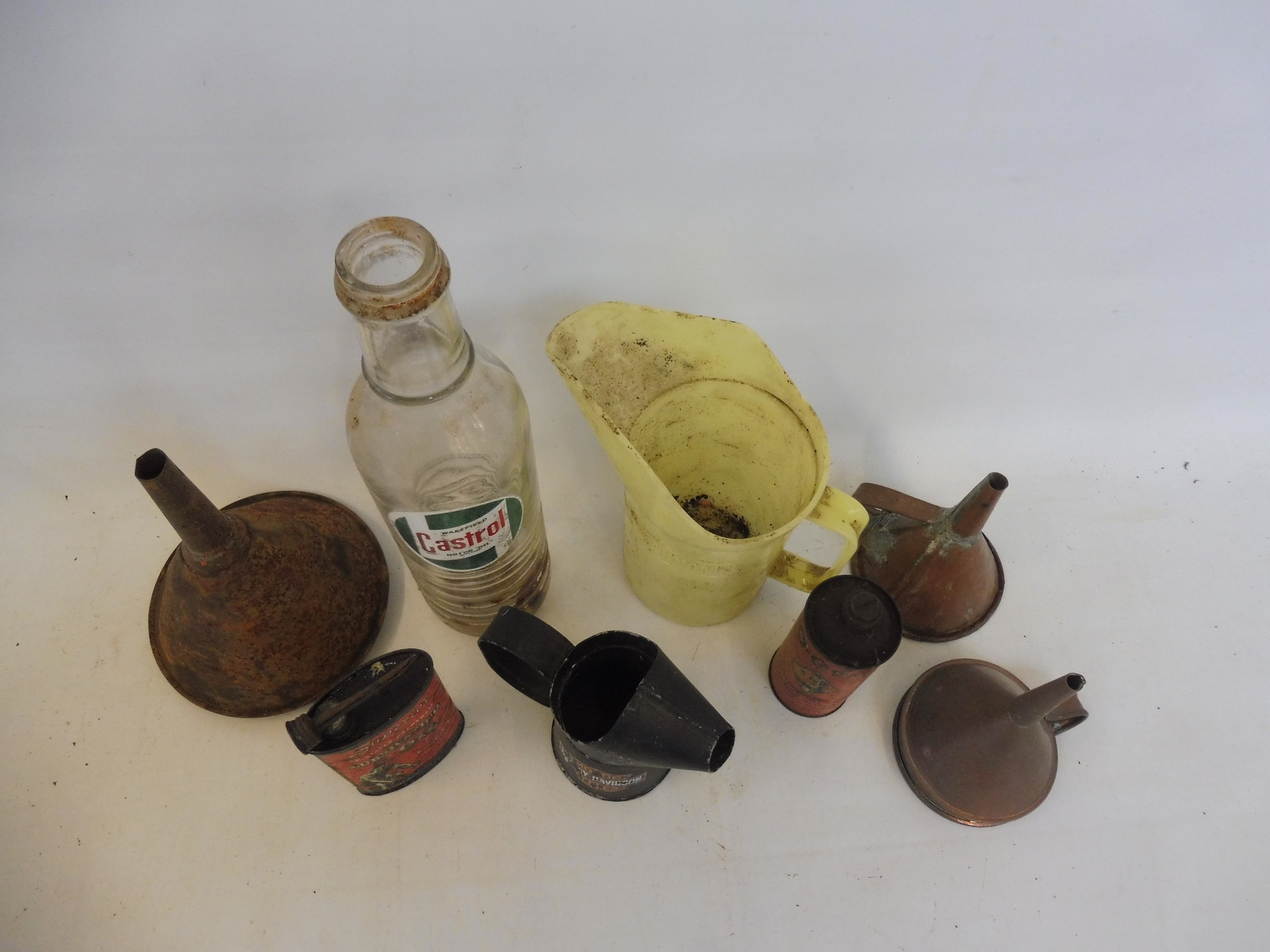 A Wakefield Castrol quart glass bottle and various oil cans, funnels and measures. - Image 2 of 2