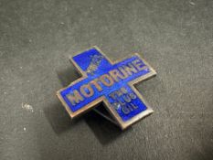A Price's Motorine cross shaped enamel lapel badge, stamped Butler to verso.