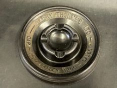 A Stanmore Products circular ashtray bearing advertising for Harry Thornes Ltd Car Sales, 5 3/4"