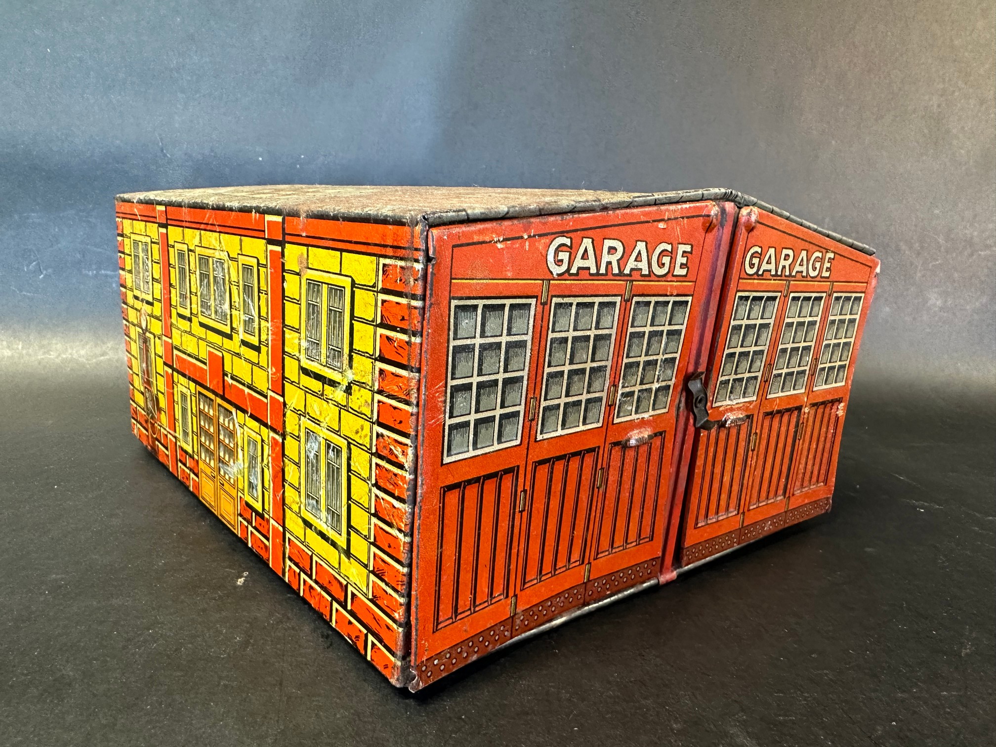 A German tinplate model of a double garage.