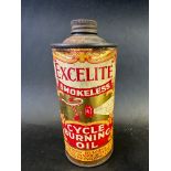 An Excelite Smokeless Cycle Burning Oil small cylindrical tin.