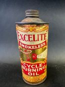 An Excelite Smokeless Cycle Burning Oil small cylindrical tin.