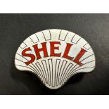 A Shell enamel cap badge by Gaunt.