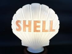 A Shell glass petrol pump globe by Webb's Crystal.