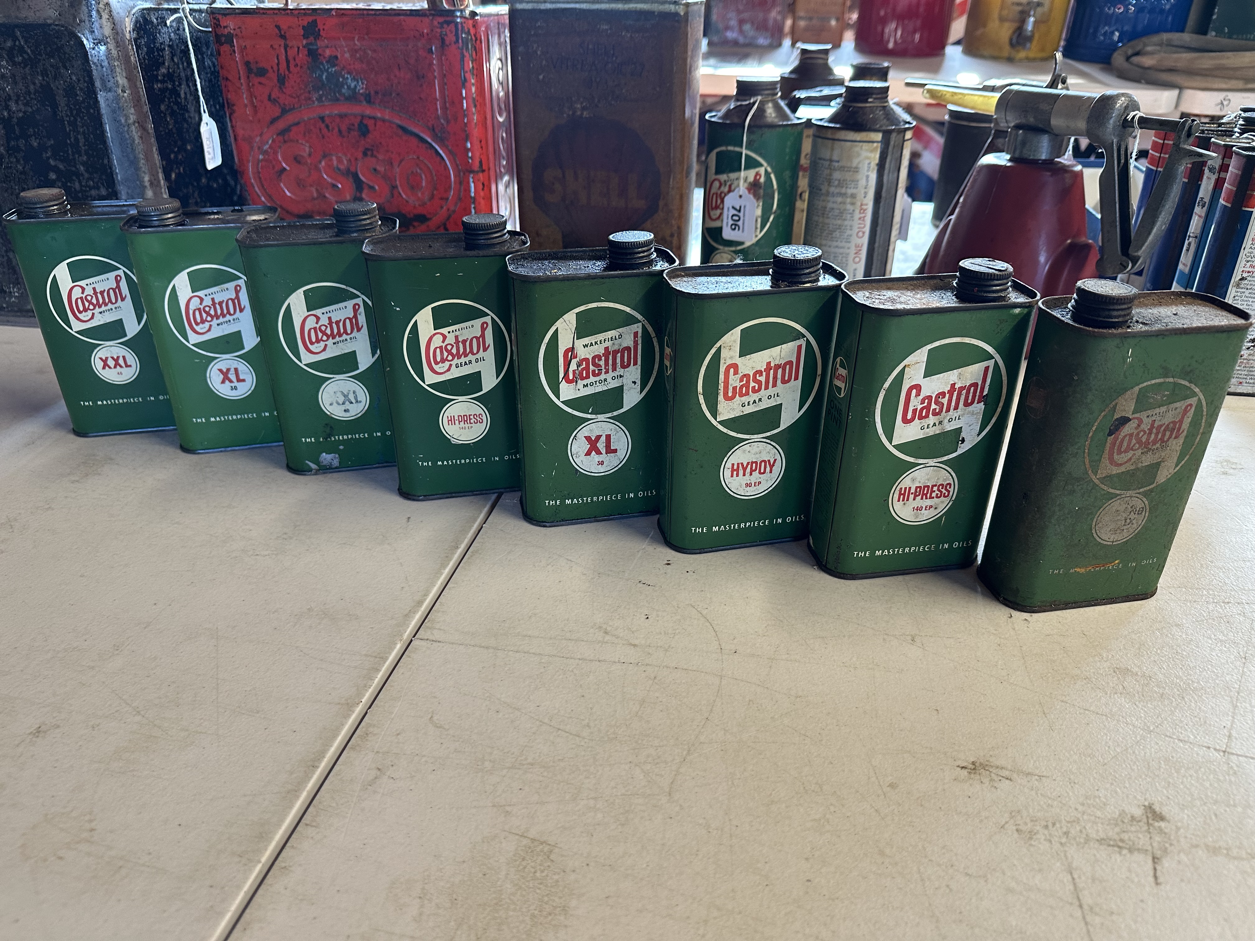 Eight Castrol pint oil cans.