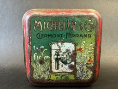 A rare and early Michelin tin, with brightly coloured designs to all sides.