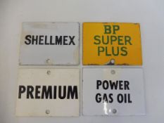 Four enamel petrol pump brand indicator plaques including BP Super Plus and Power Gas Oil.