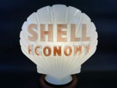 A Shell Economy glass petrol pump globe by Hailware, fully stamped underneath.