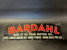 A rectangular tin sign advertising Bardahl, 24 x 7 1/4".