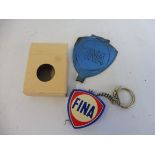 A Fina promotional tape measure and a Fina tin coat hanger.