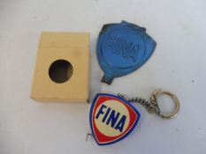 A Fina promotional tape measure and a Fina tin coat hanger.