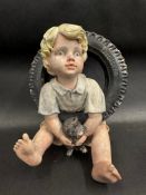 A rare Firestone Tyres advertising figure, possibly a hard plaster or form of porcelain, depicting a