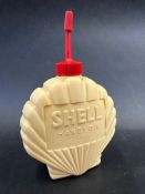 A plastic shell shaped Shell Handy Oil can.