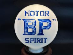 An early BP Motor Spirit pill shaped glass petrol pump globe with incised letters.