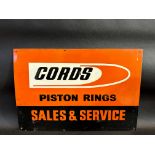 A Cords Piston Rings Sales and Service rectangular tin advertising sign, 22 x 15".
