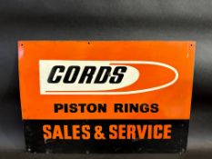 A Cords Piston Rings Sales and Service rectangular tin advertising sign, 22 x 15".