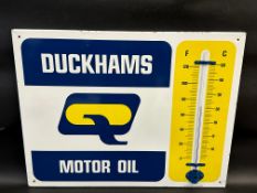 A Duckhams Motor Oil enamel thermometer by Burnham of London, in excellent condition, 26 x 20".