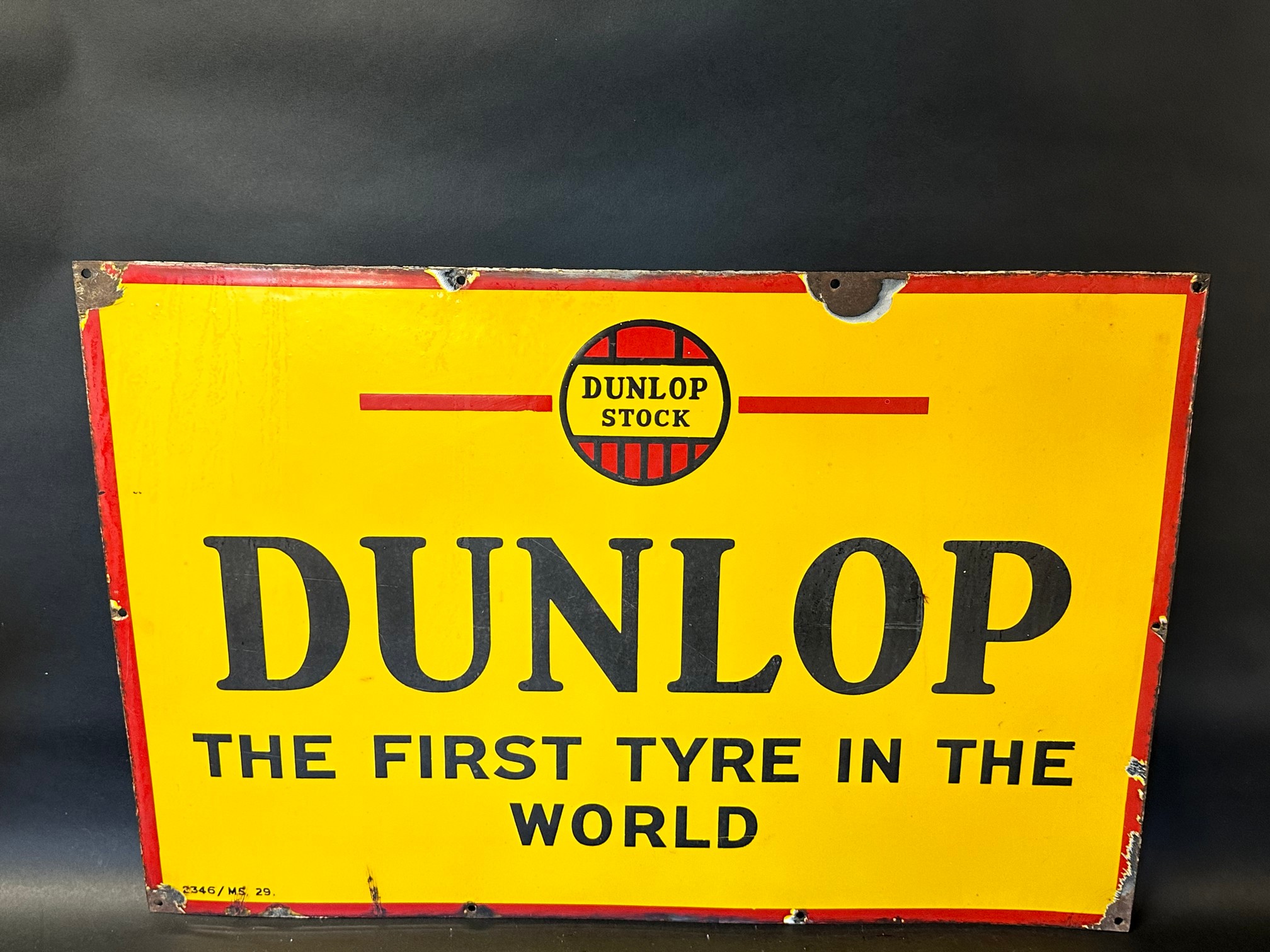 A Dunlop 'The first tyre in the world' enamel sign in good condition, 30 x 20".