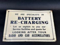 A celluloid rectangular sign 'Battery Re-Charging', supplied by 'The Garage and Motor Agent', 10 1/2