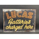 A Lucas Batteries Charged Here rectangular tin advertising sign, 27 x 19".