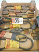 Two trays of assorted spark plug tins including Massa, puncture repair outfit tins etc.