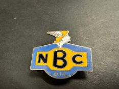 An NBC Oil enamel lapel badge by Gaunt.