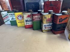 Seven quart oil cans, various brands including Mobiloil Special, Girling etc.