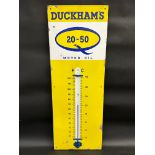 A Duckham's 20-50 Motor Oil enamel thermometer, 13 x 36".