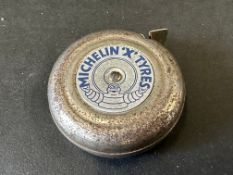 A Michelin Tyres branded tape measure.