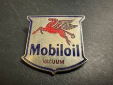 A Mobiloil pegasus part enamel lapel badge by H.W.Miller.