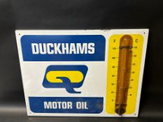 A Duckhams Motor Oil enamel thermometer by Burnham, 26 x 20".