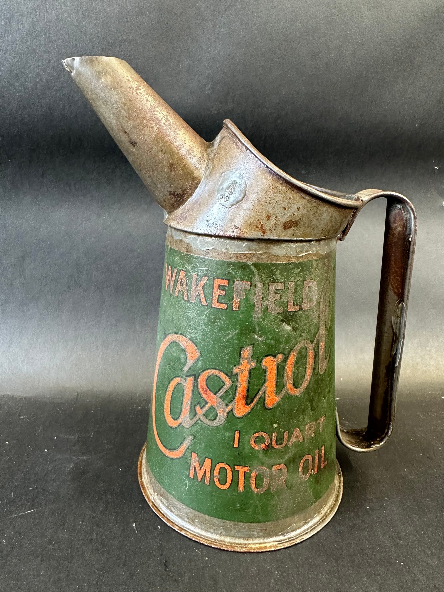 A Wakefield Castrol Motor Oil quart measure, dated 1930.