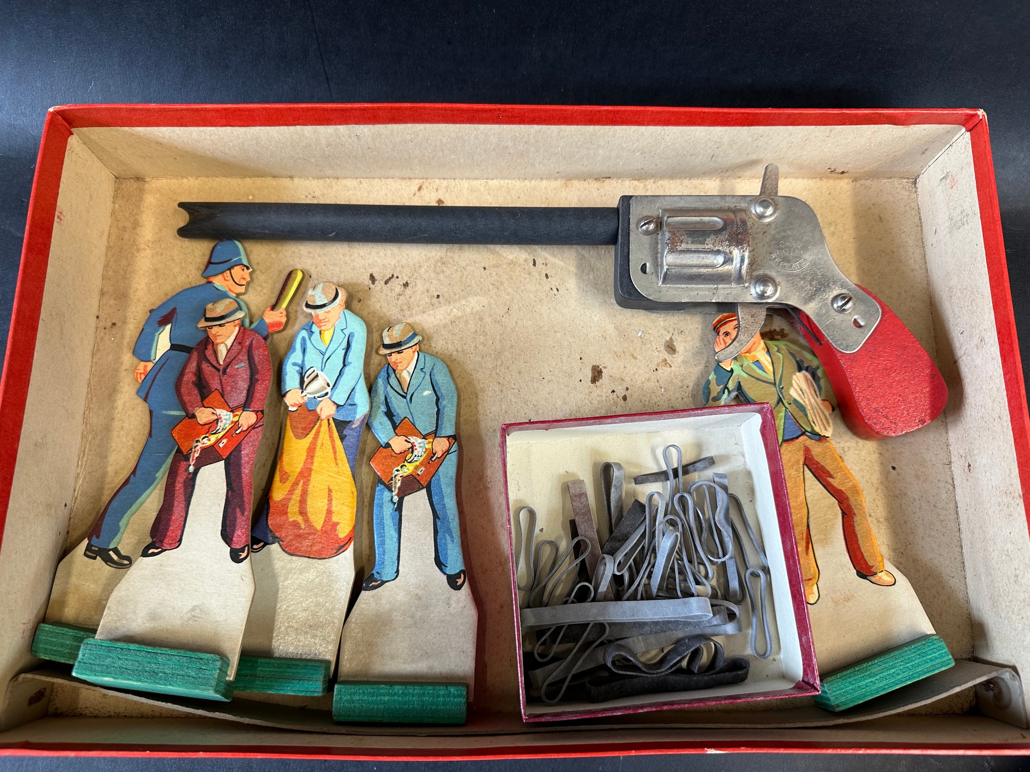 A boxed Chad Valley Bandit Shooting Game, depicting a pre-war open top motor car to the front of the - Image 2 of 2