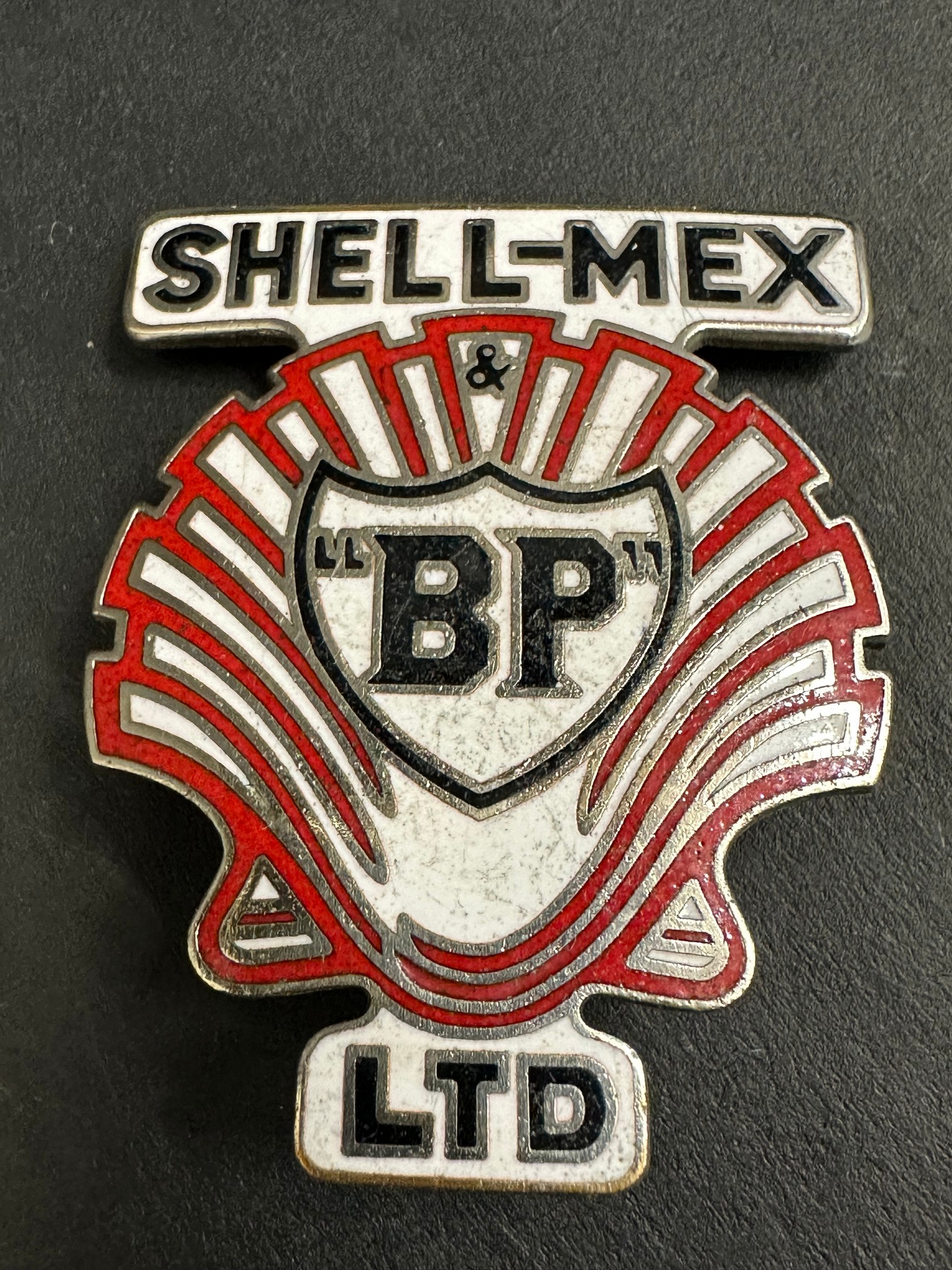 A Shell-Mex & BP Ltd part enamel cap badge.