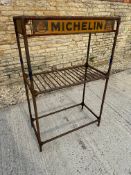 A Michelin tyre rack, with signs all round.