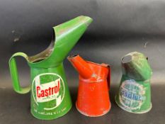 A Vitafilm pint measure, dated 1947, an Essolube pint measure and a Castrol quart measure.