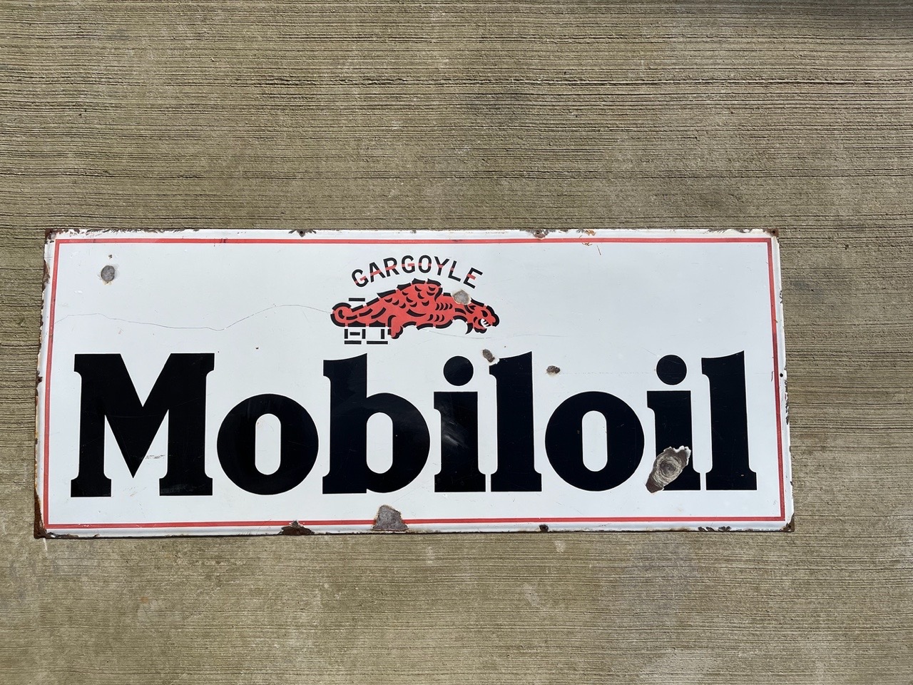 A Continental Mobiloil rectangular enamel sign in good condition.