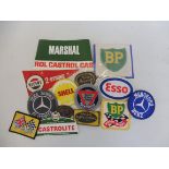 A selection of embroidered patches and other promotional items.