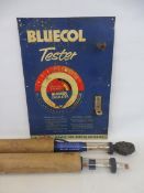 A Bluecol Tester tin sign with two tubes in original cardboard tubes.