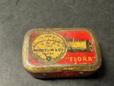 A Michelin 'Flora' tyre pressure gauge in original tin.