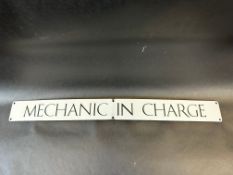 A 'Mechanic in Charge' narrow enamel sign, 24 x 2 1/2".