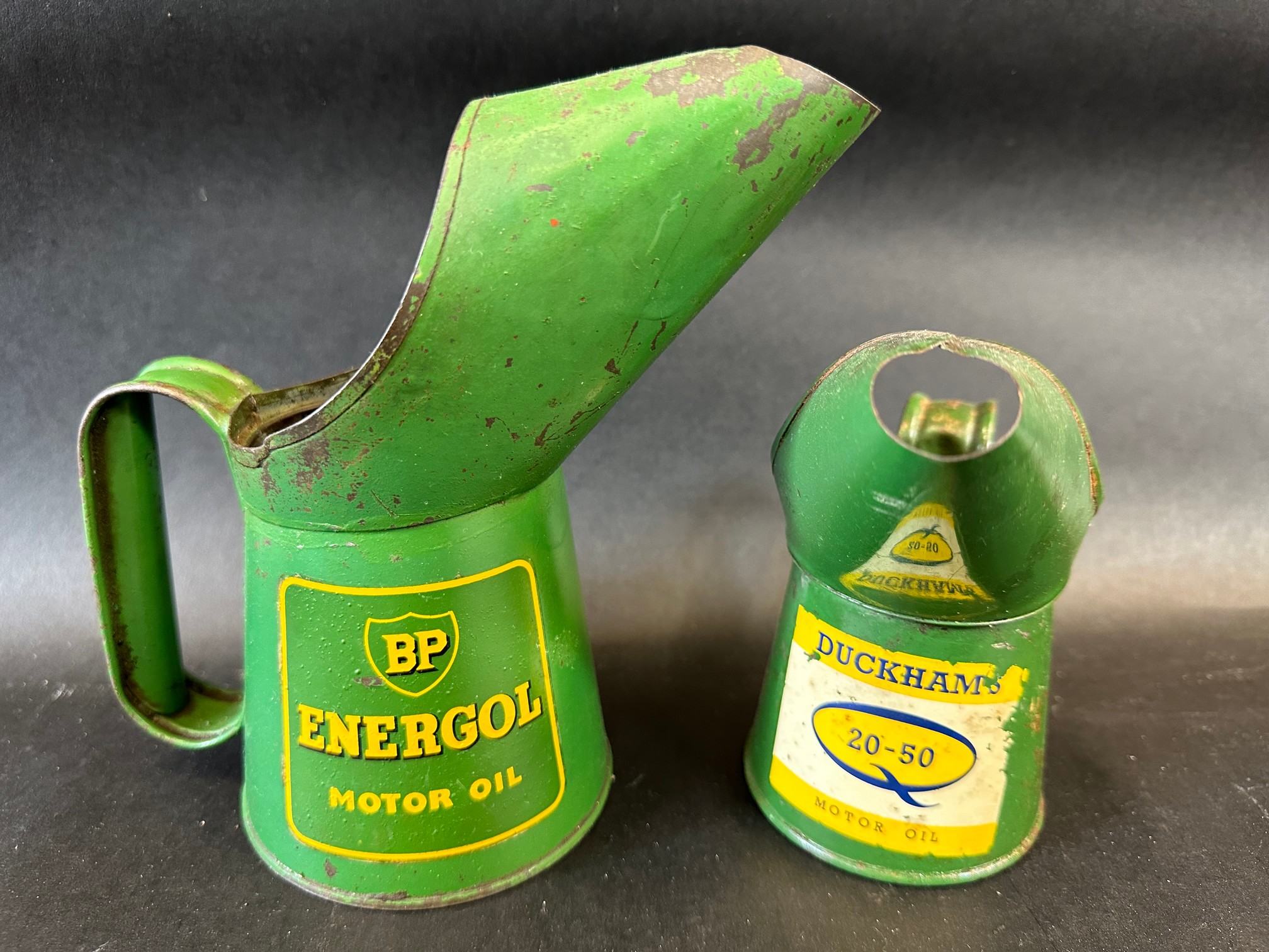 A BP Energol Motor Oil pint measure dated 1956 and a Duckhams 20-50 half pint measure dated 1965.