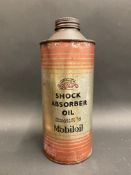 A Gargoyle Shock Absorber Oil quart cylindrical oil can.