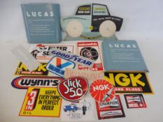 A selection of original garage stickers including NGK, Valvoline and Goodyear, plus a Lucas Reflex